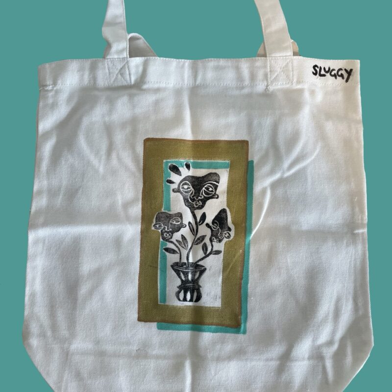 White canvas tote with slug stamp
